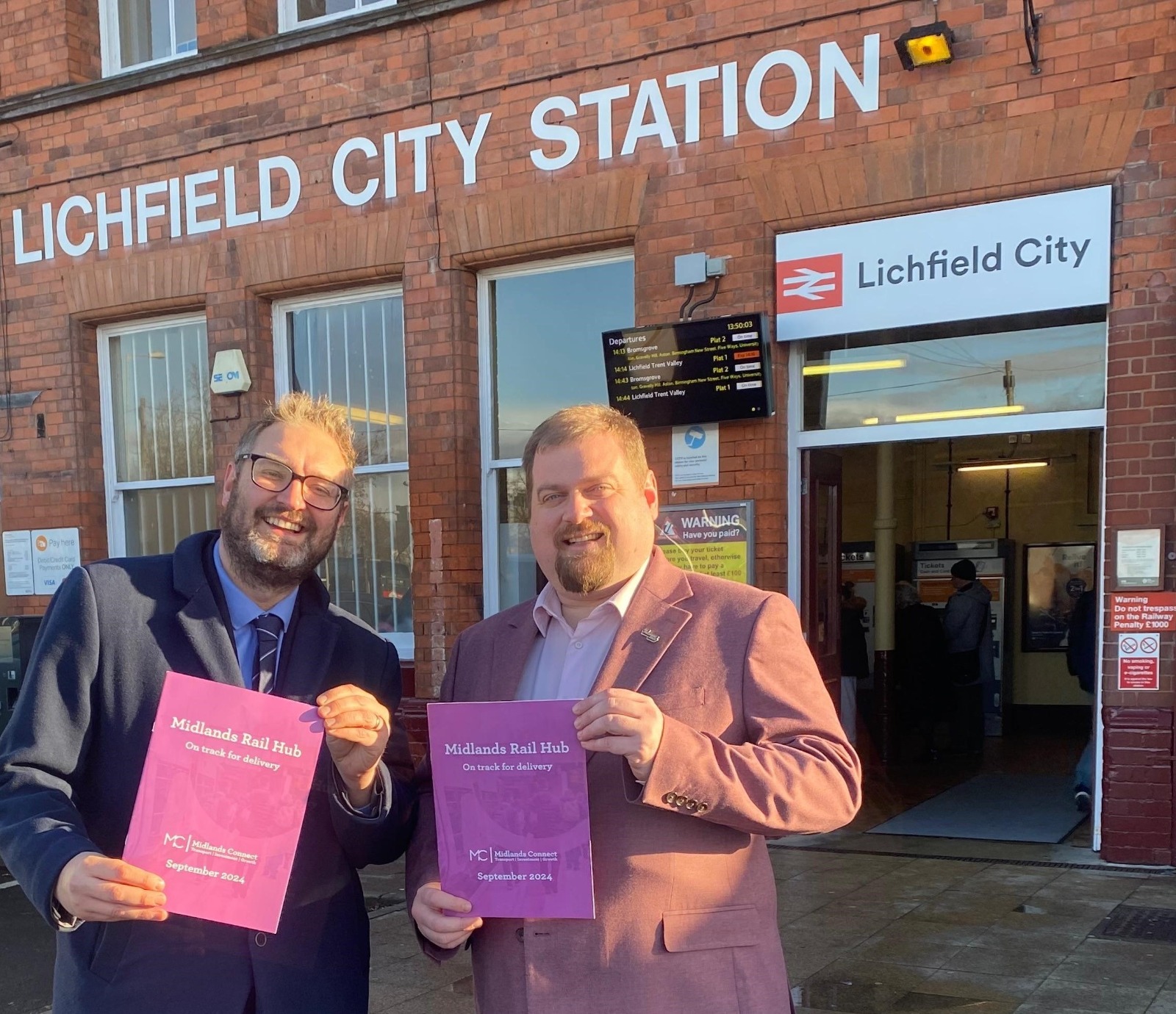 Two men stood at Lichfield City Station